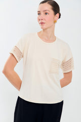 Tee shirt con puños y bolsillo en malla