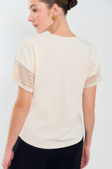 Tee shirt con puños y bolsillo en malla