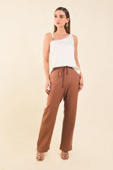 Blusa asimetrica c/herrajes en tira