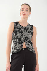 Chaleco corto bordado con botones forrados